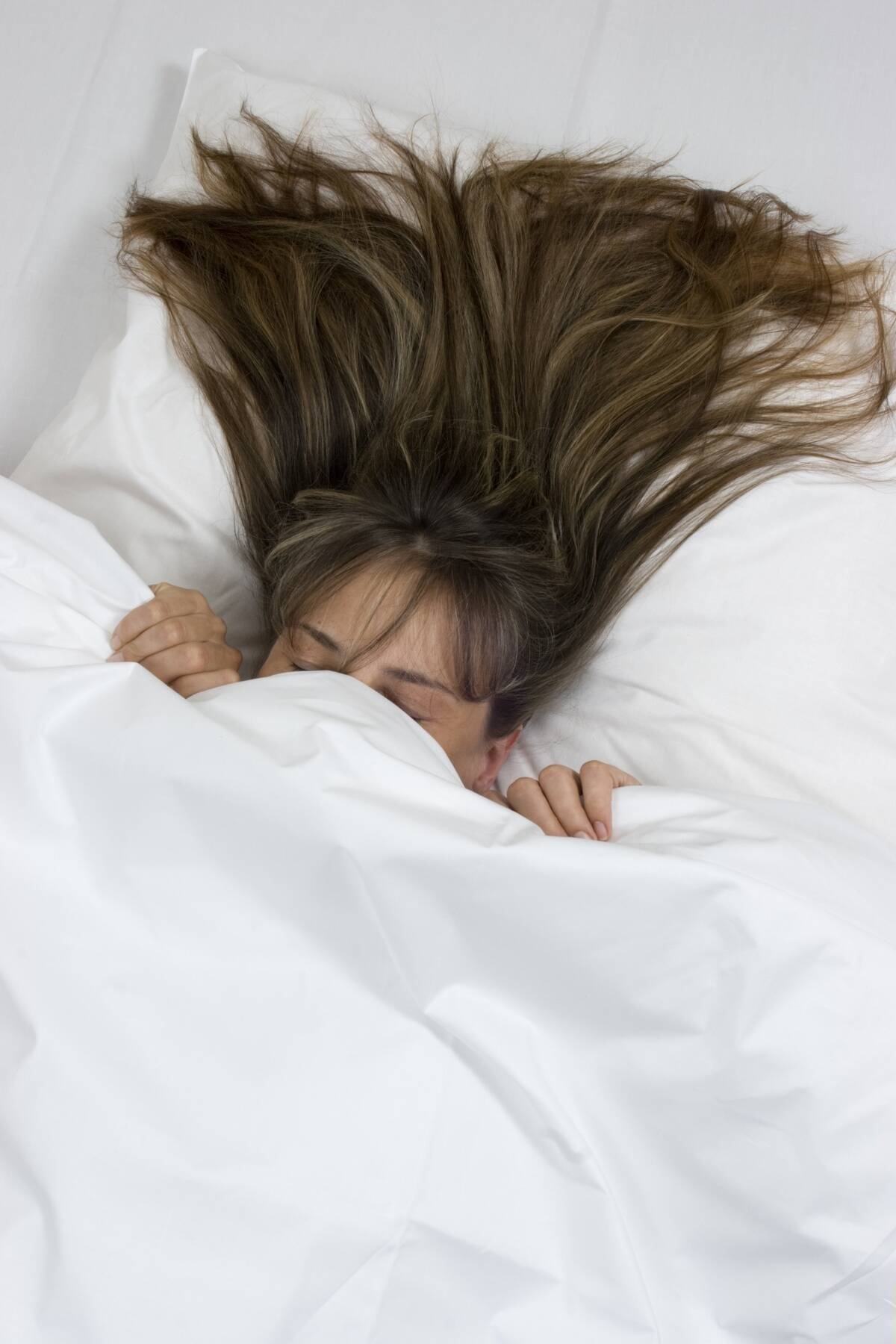 woman is sleeping in bed