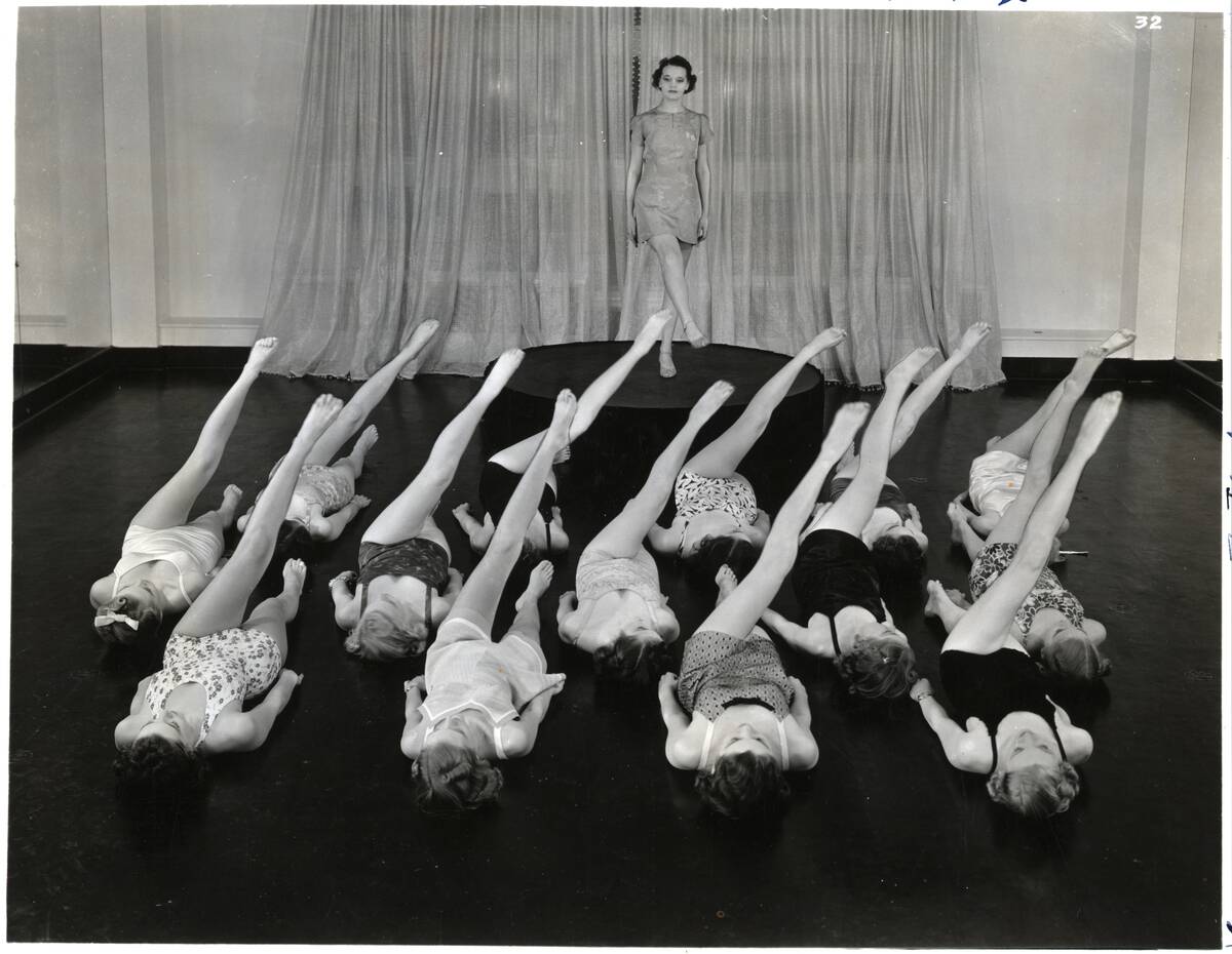 Women Lying In Rows Doing Leg Lifts