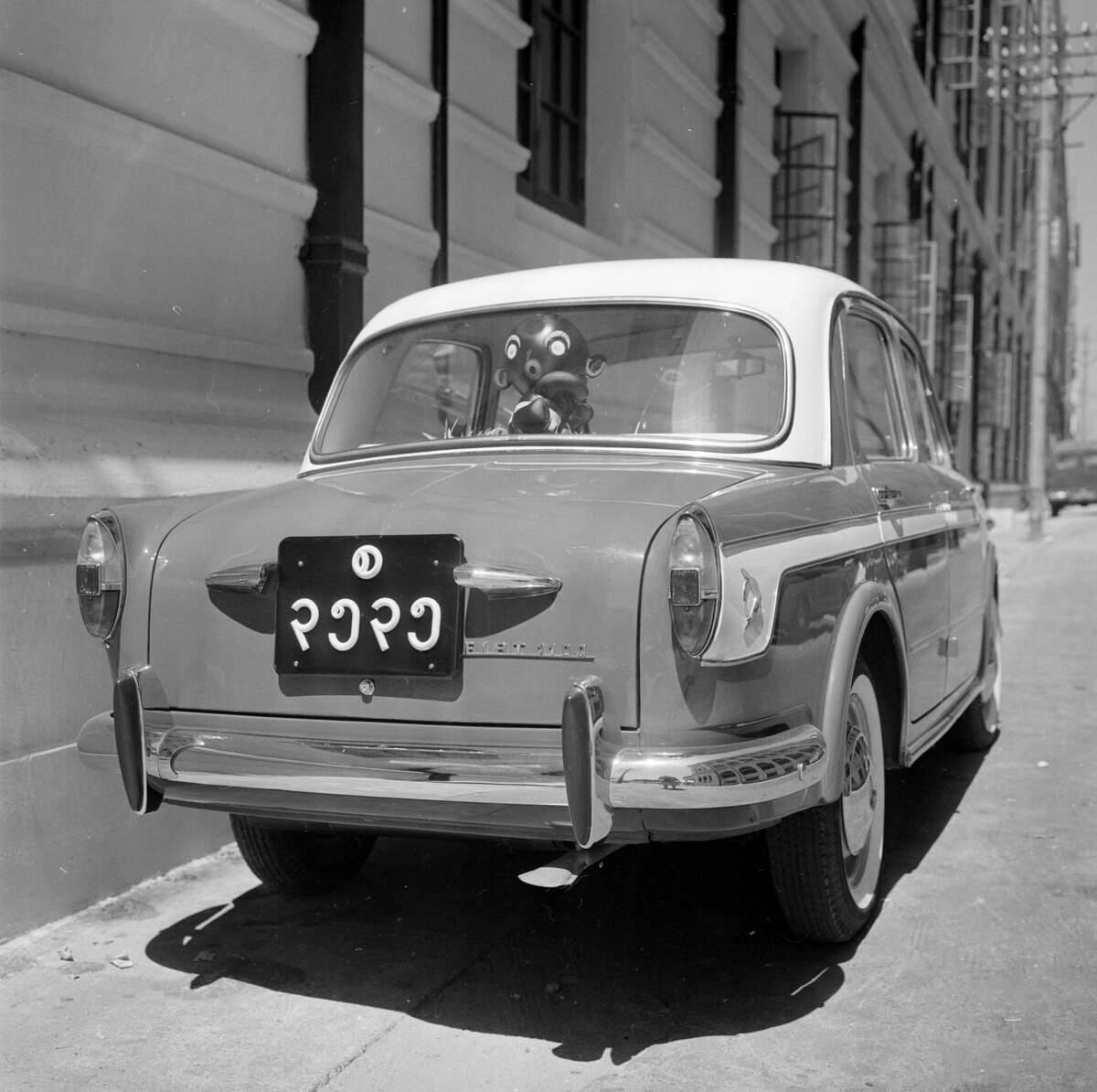 Car Fiat 1100 with number plate of Burmese charact