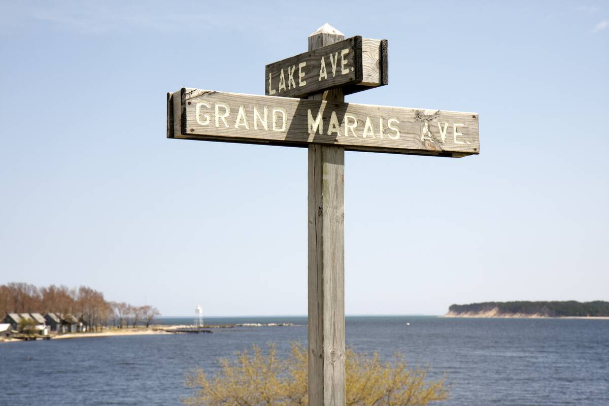 Grand Marais Avenue and Lake Avenue signs.