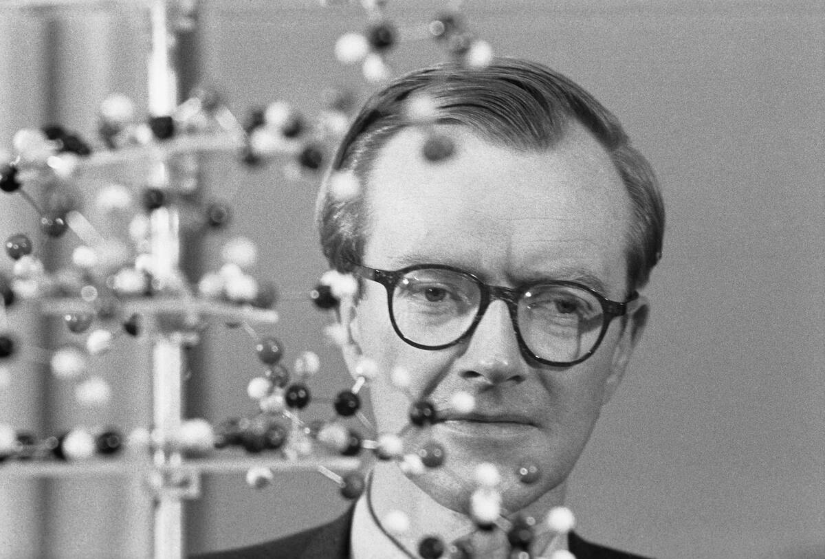 Maurice Wilkins with Molecular Model