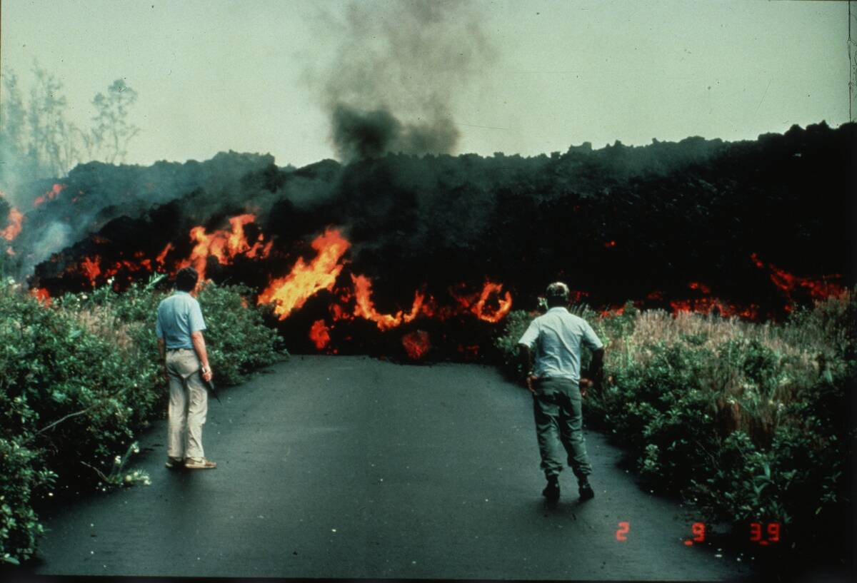 Scientists Observing Lava Flow