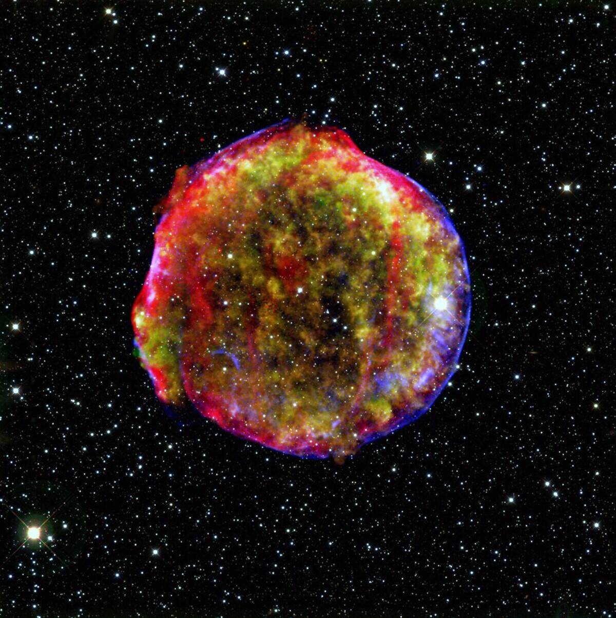A composite image of the Tycho supernova remnant. Spitzer and Chandra space observatories. It shows the scene more than four centuries after the star explosion.