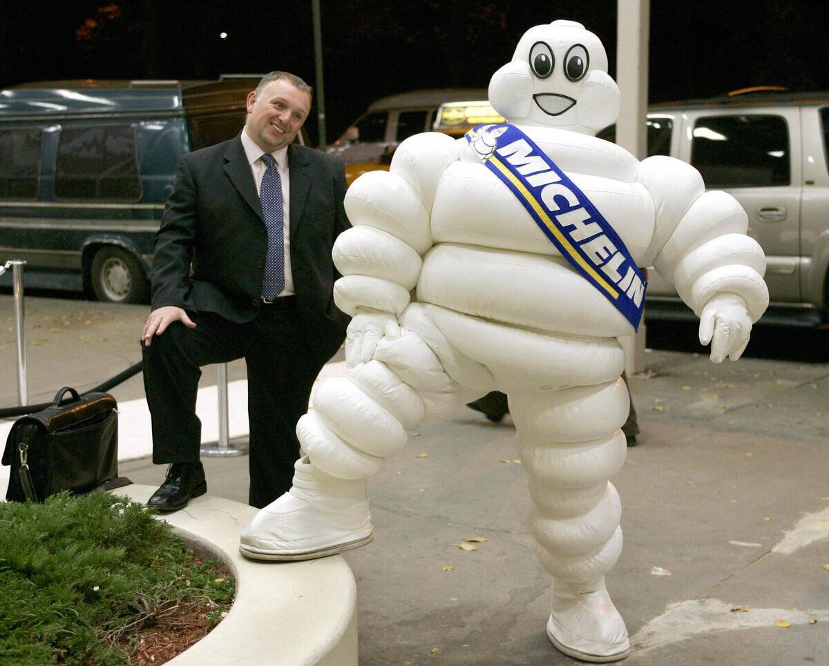 A guest is mimiked by the Michelin Man o