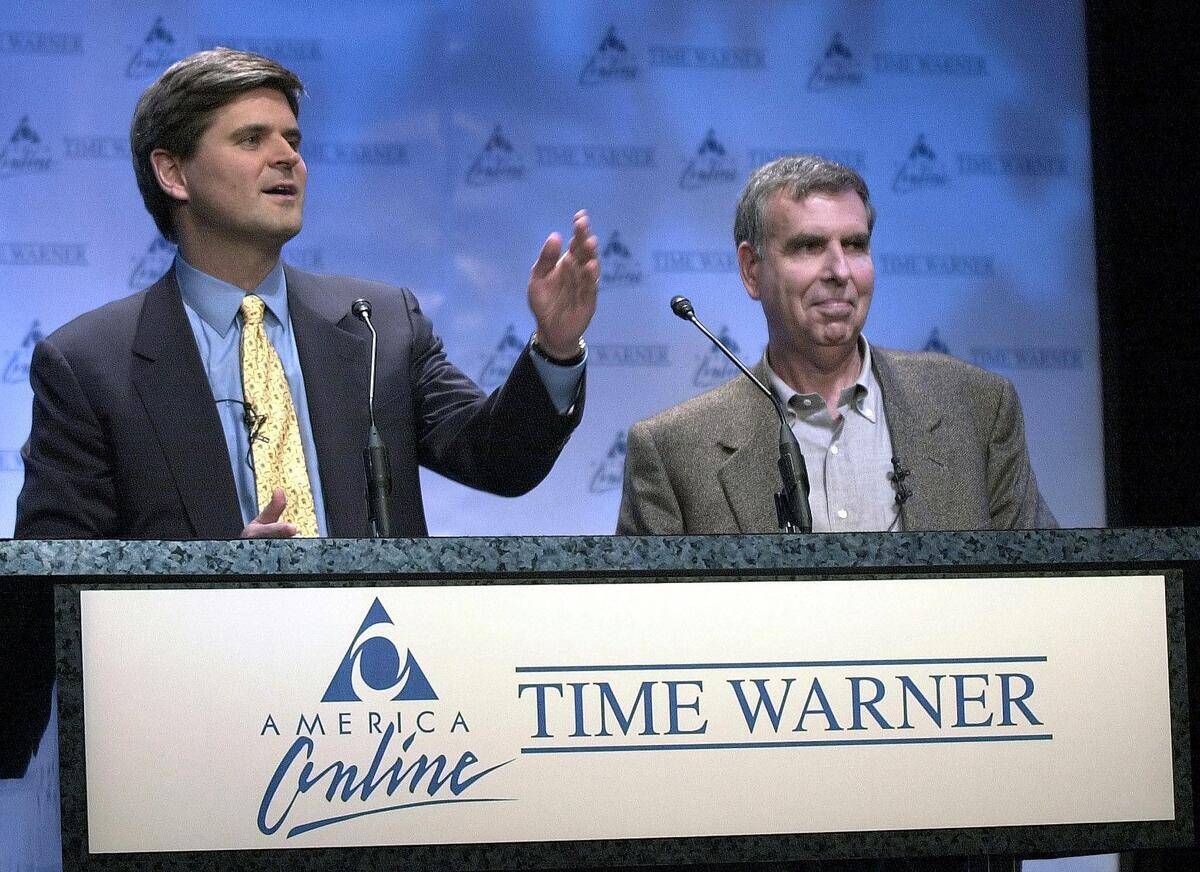 America Online Chairman Steve Case (L) and Time Wa