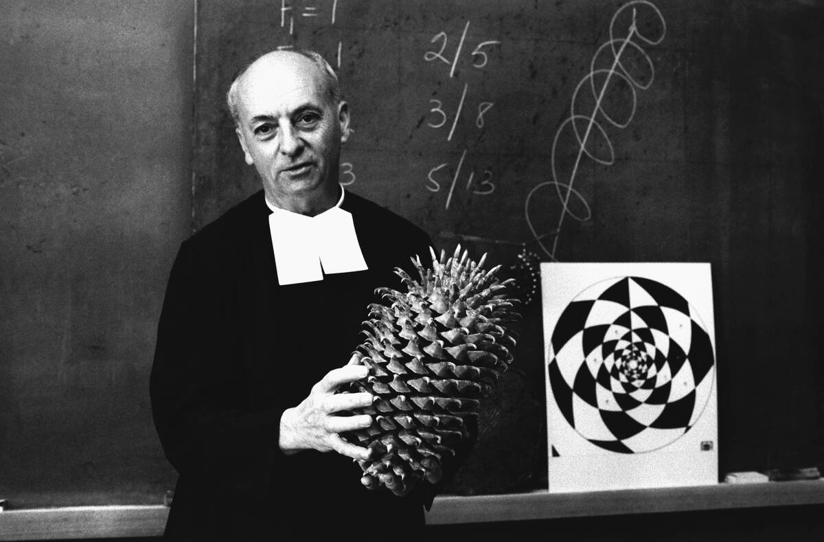 Brother Brousseau Holds Pinecone