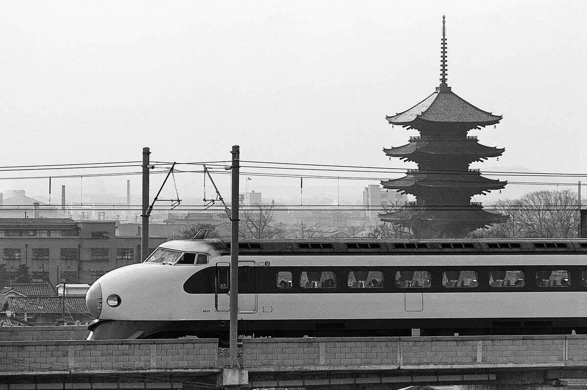 Bullet Train Running Past Pagodas