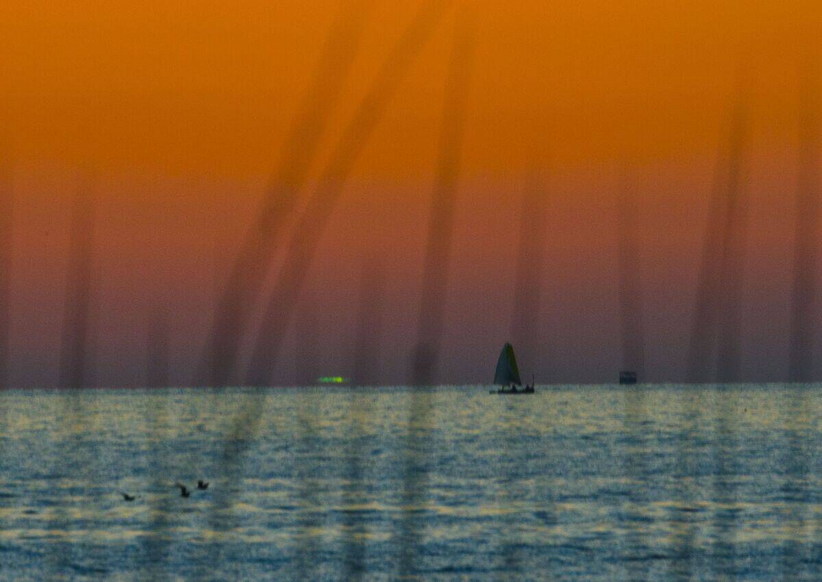Florida, Sarasota, Siesta Key, Orange Sunset with rarely seen Green Flash