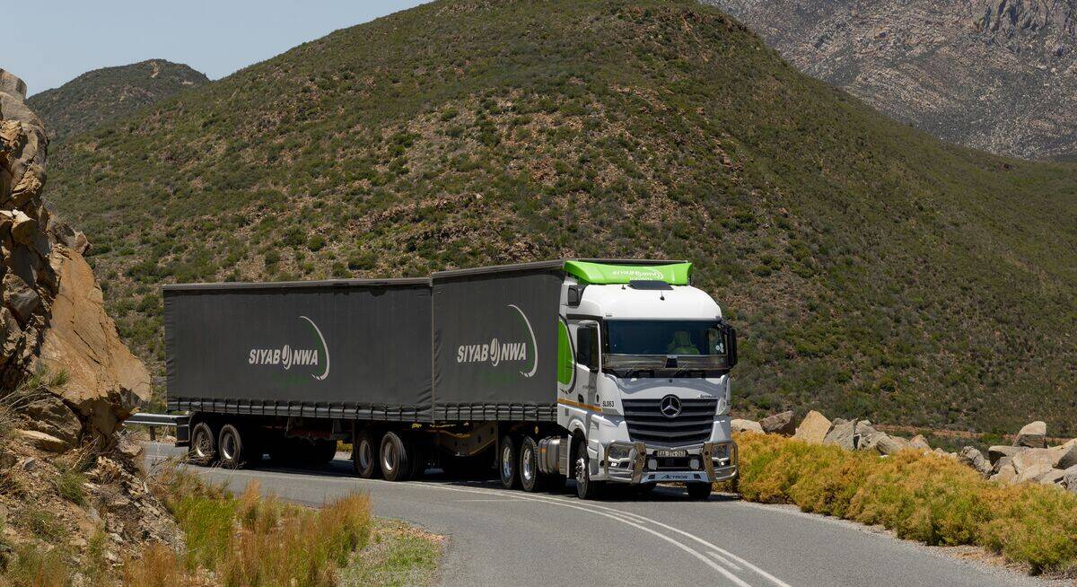 Kersie, Western Cape, South Africa, 12 wheeler truck and two trailers climbing a steep section of the Burgers Pass, Southern Africa.