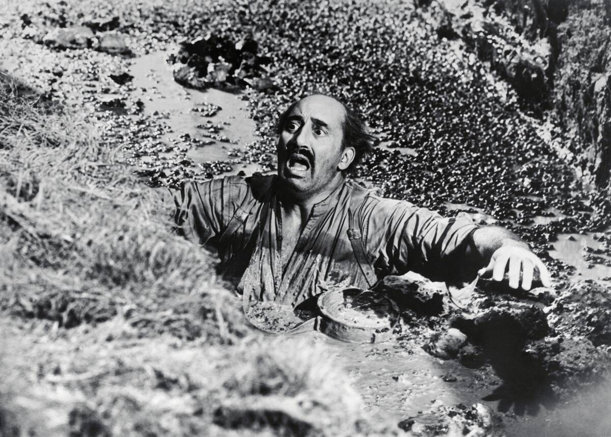 Man Sinking in Quicksand in Movie Scene