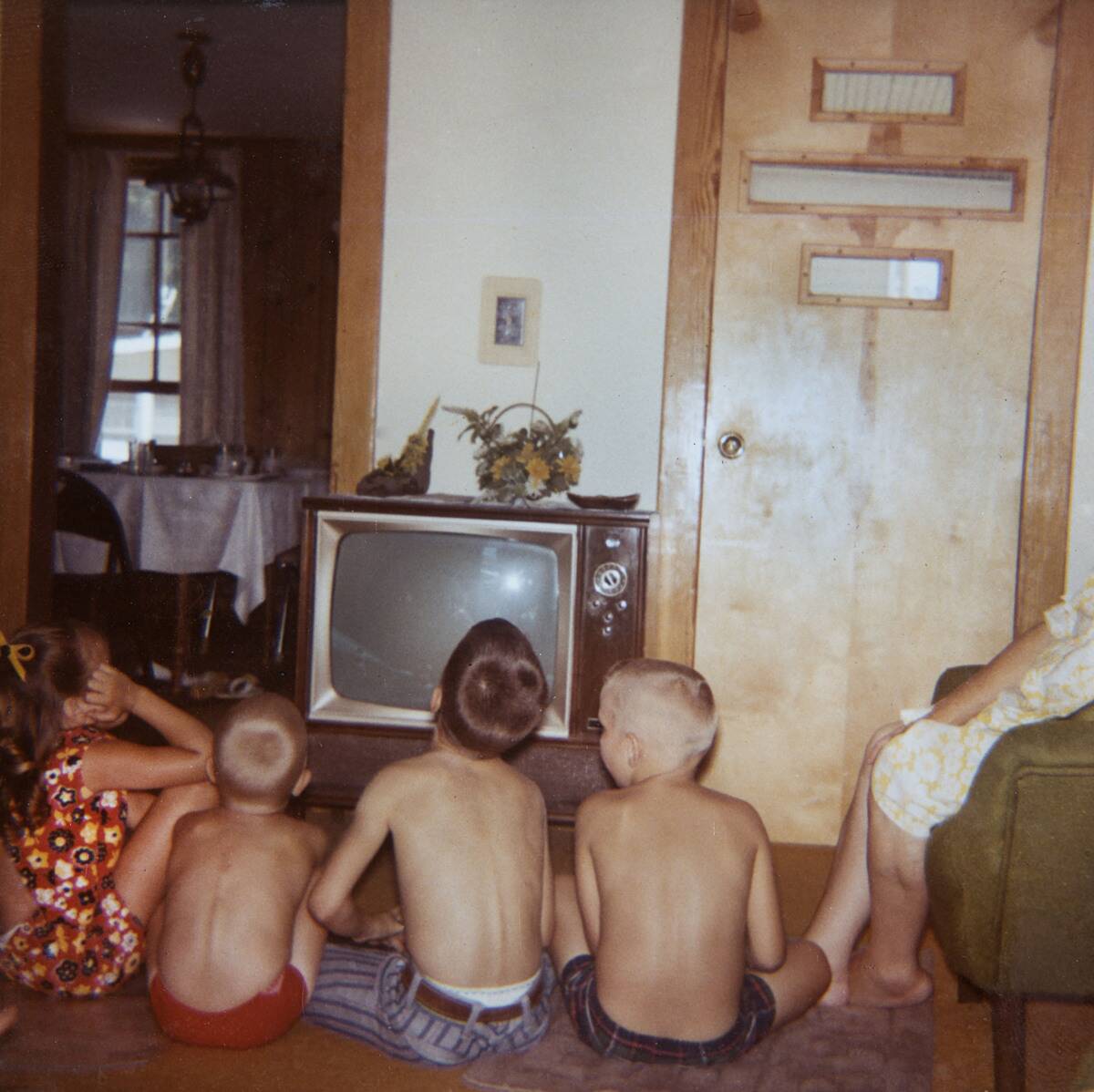 Neighborhood kids watch television, ca. 1969.