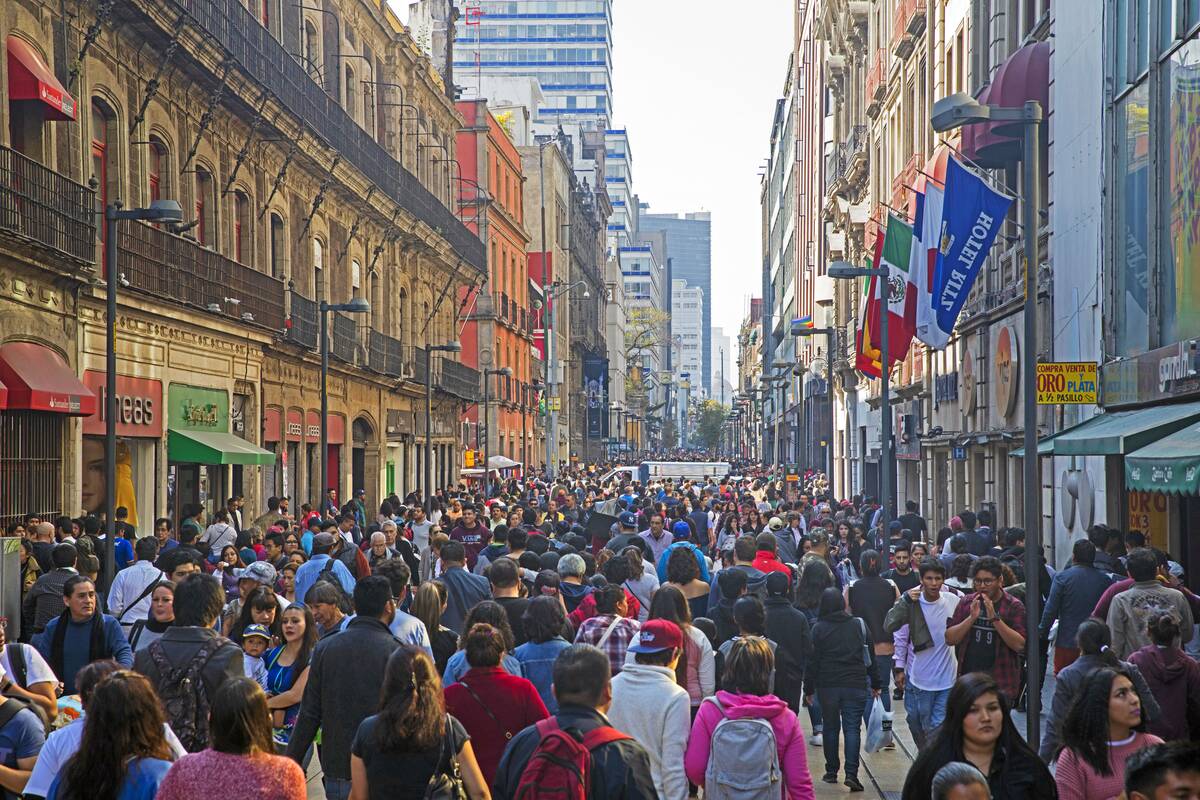 Pedestrians and shoppers walking in the Calle Madero. Francisco I. Madero Avenue. Madero Street in the historic city centre of Mexico City
