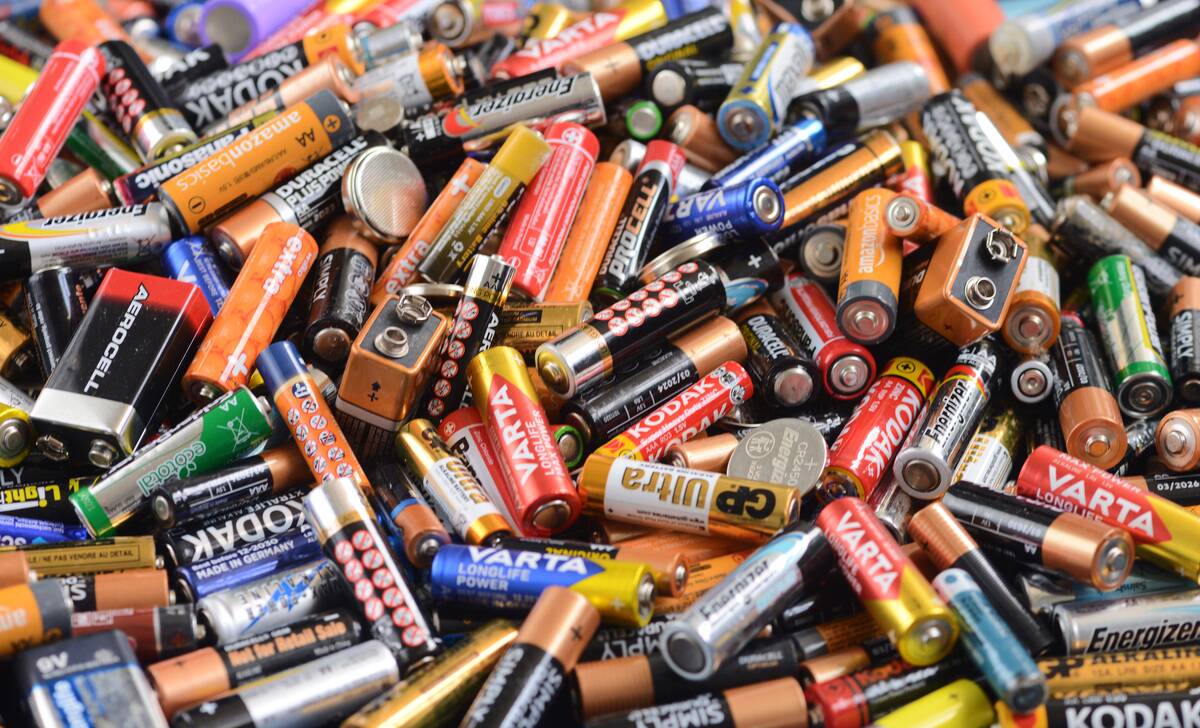 Recycling bin full of used batteries