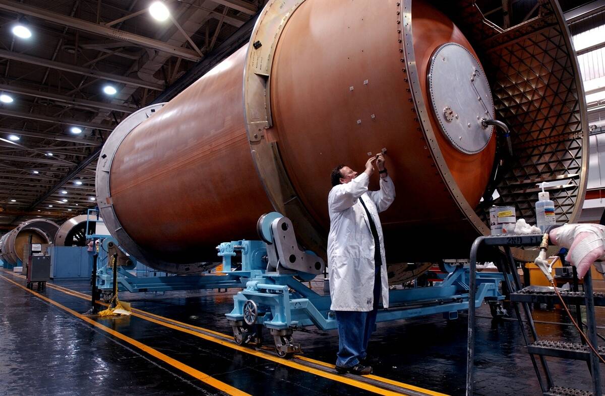 Senior mechanic Gene Cozart works on an Atlas V fuel tank in the Atlas V Manufacturing Facility at Lockheed Martin Waterton Canyon facility. (Craig F. Walker/ The Denver Post) (AV-001 RP-1)