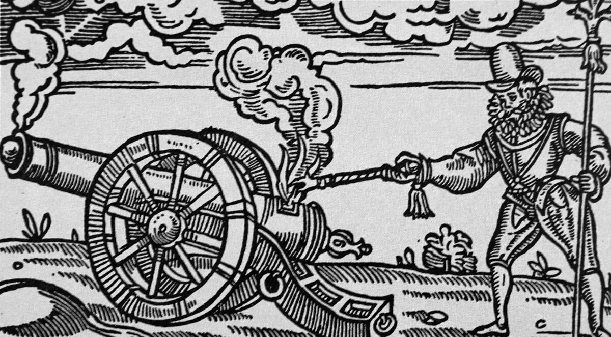 The fuse of a cannon being lit.