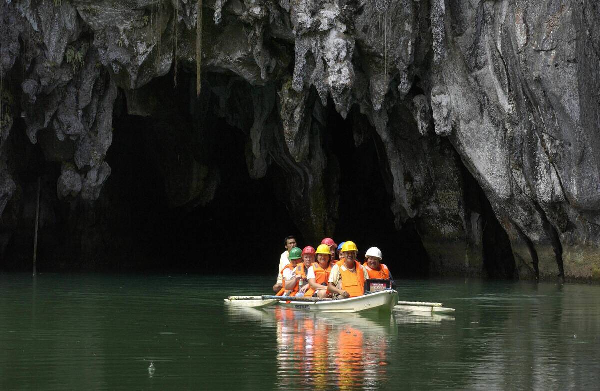 Tourists explore the subterranean river...