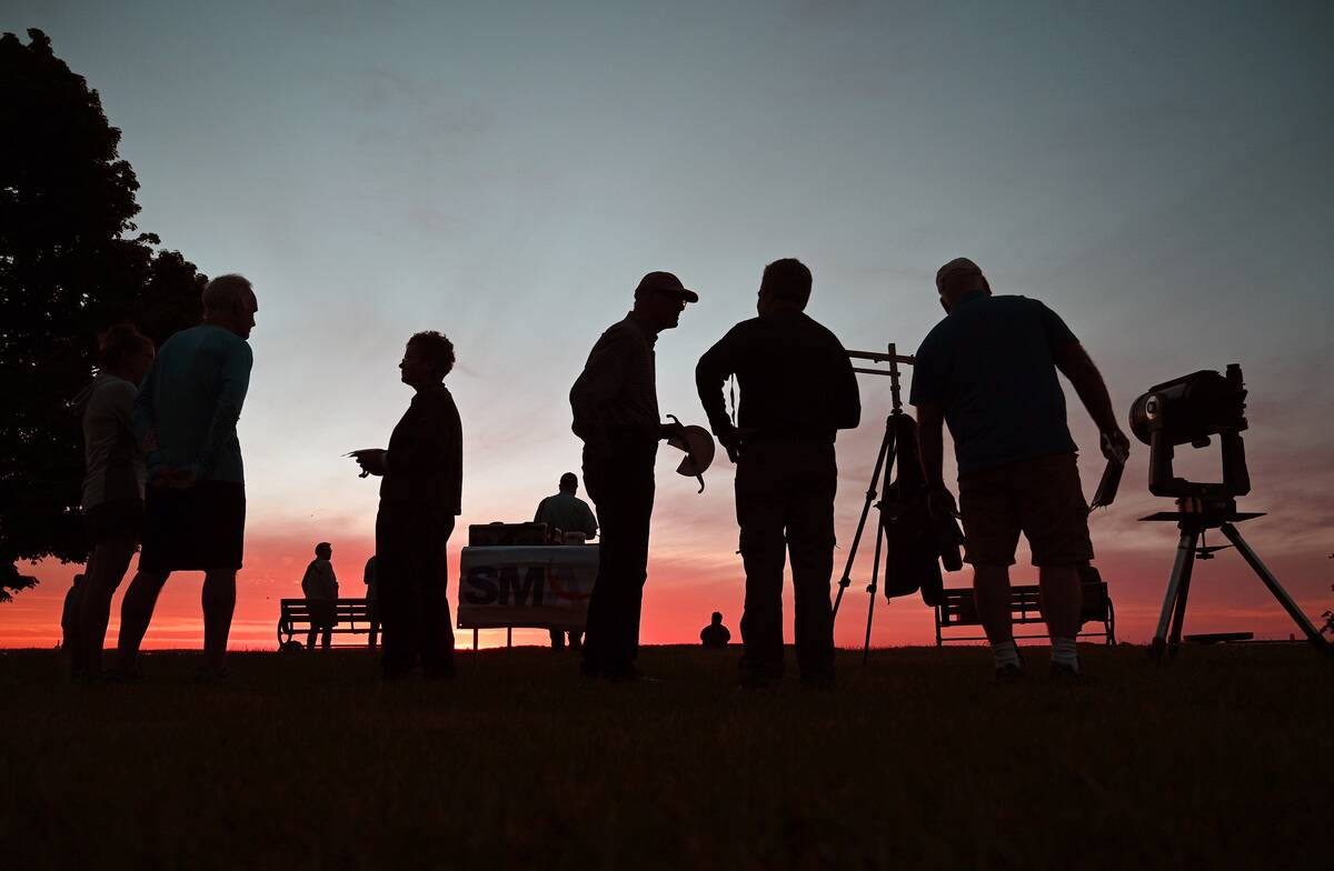 Amateur astronomers gather to watch a partial eclipse from the Eastern Prom in Portland