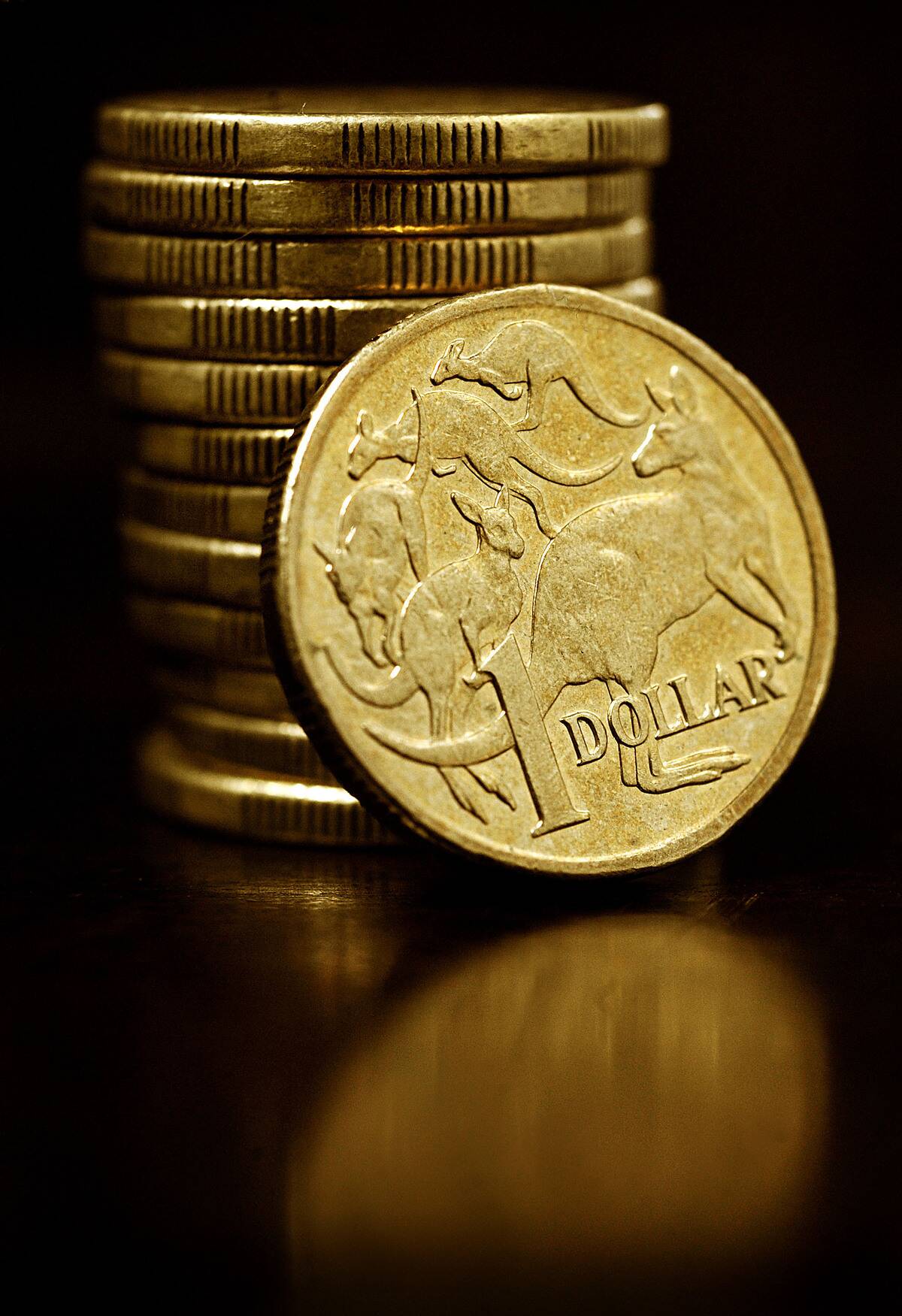 Australian one-dollar coins are arranged for a photograph in