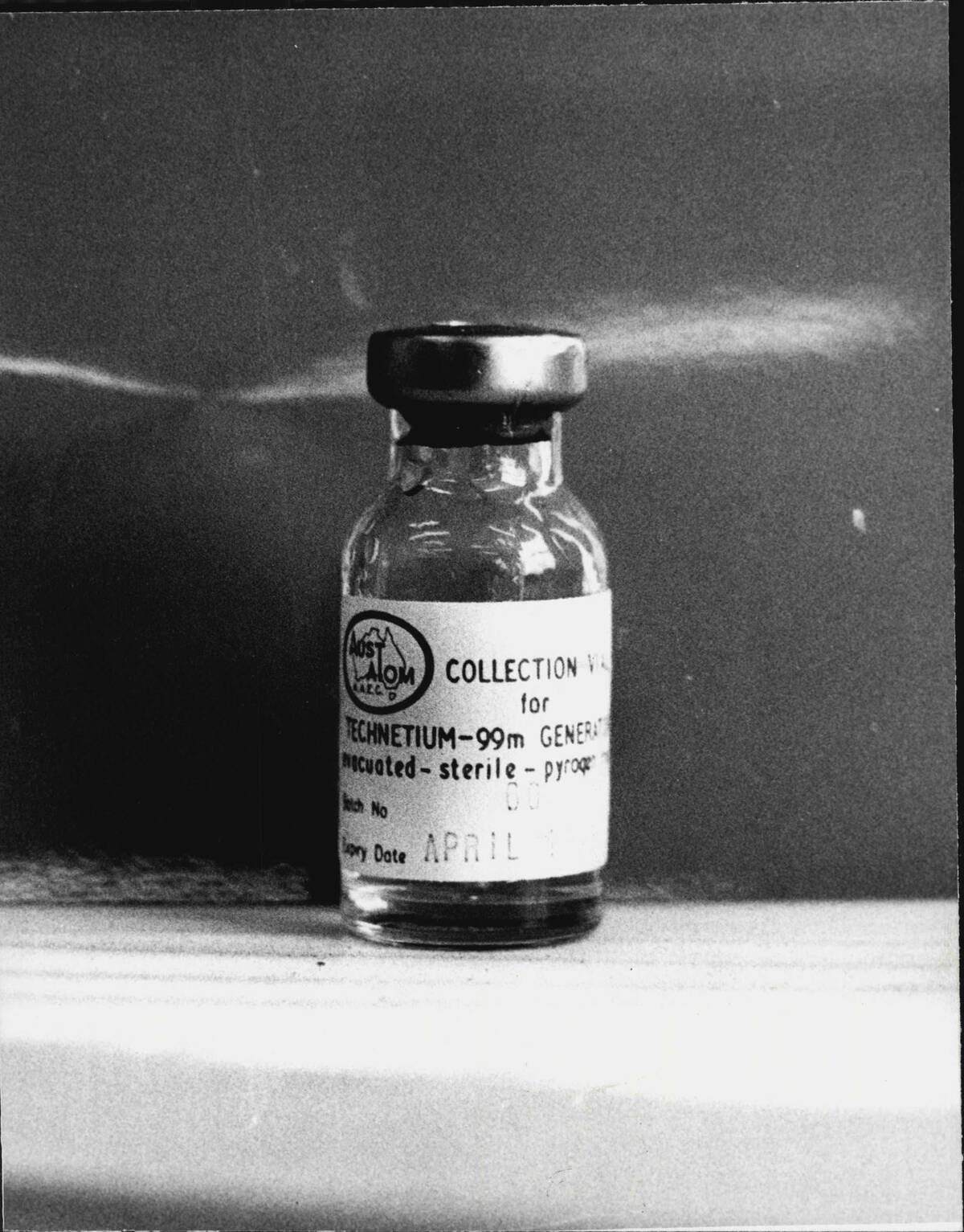 Bottle of Technetium.Australian Atomic Commission Research establishment at Lucas Heights - industrial troubles, preventing production of medical isotopes...