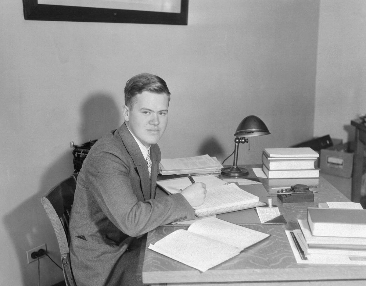 Scholarship Winner John Tukey Sitting at Desk