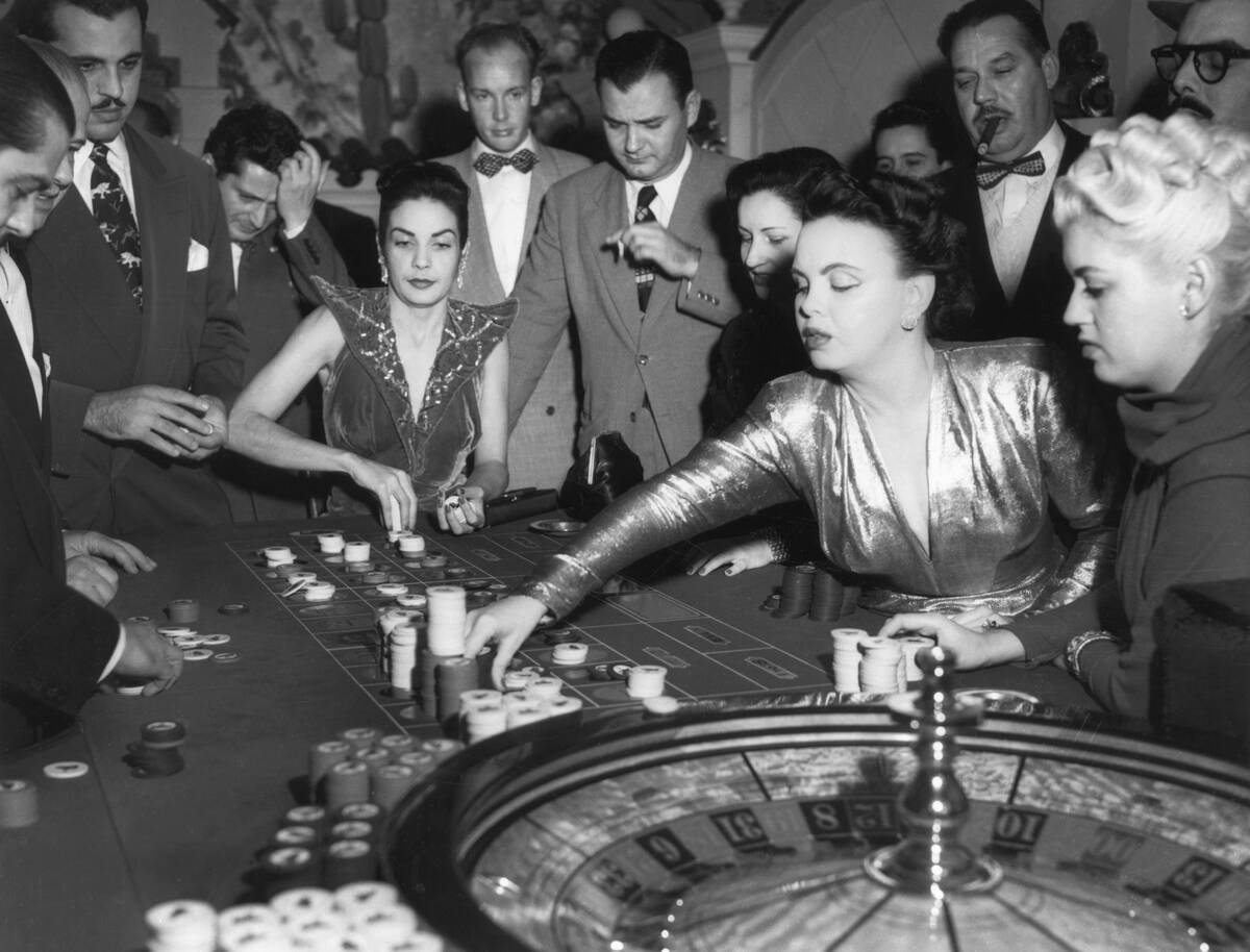 Woman Placing a Bet at a Roulette Wheel