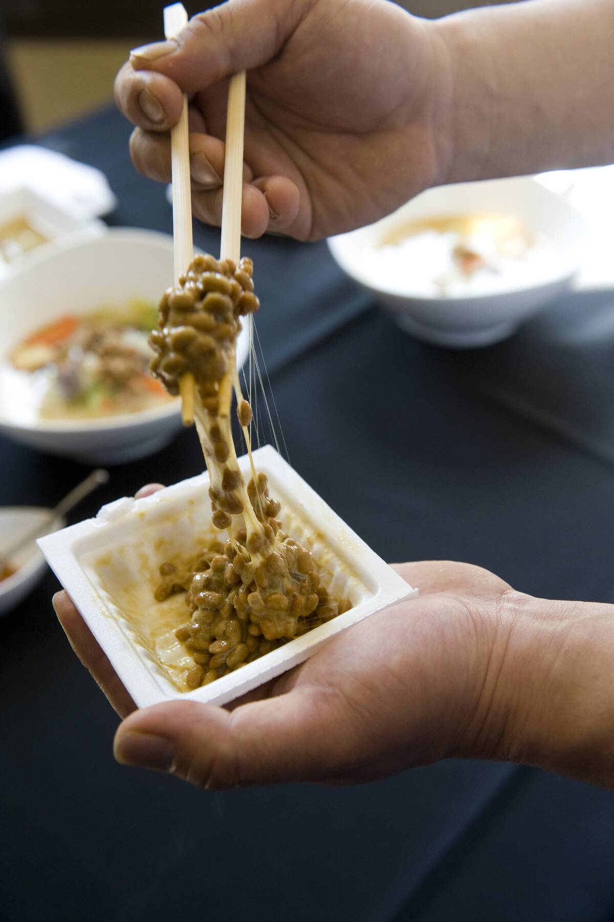 26-March-2010 Pix of natto, fermented soybeans. Pix are of them plain, being stirred, and into a sou
