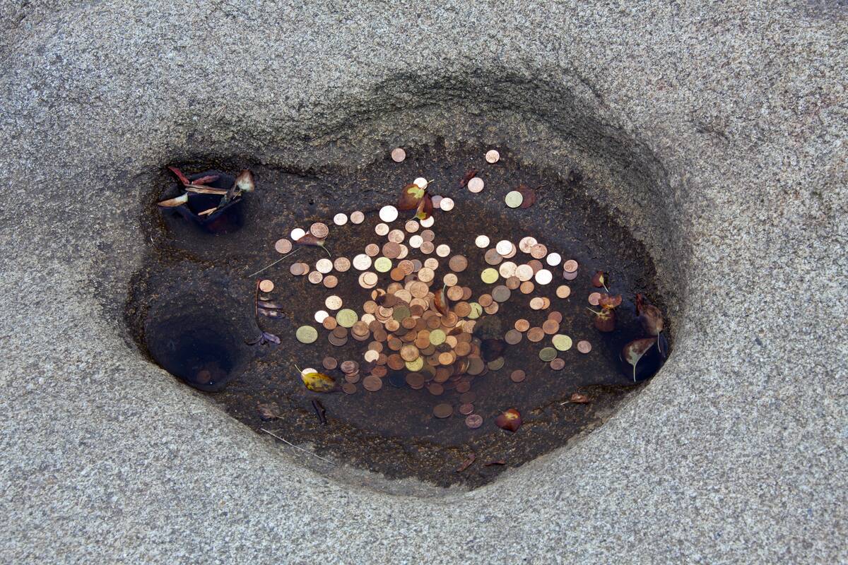 Coins in water of the Rosstrappe wishing well, horseshoe imprint in rock at the Rosstrappe, Harz mountains, Thale, Saxony-Anhalt, Germany