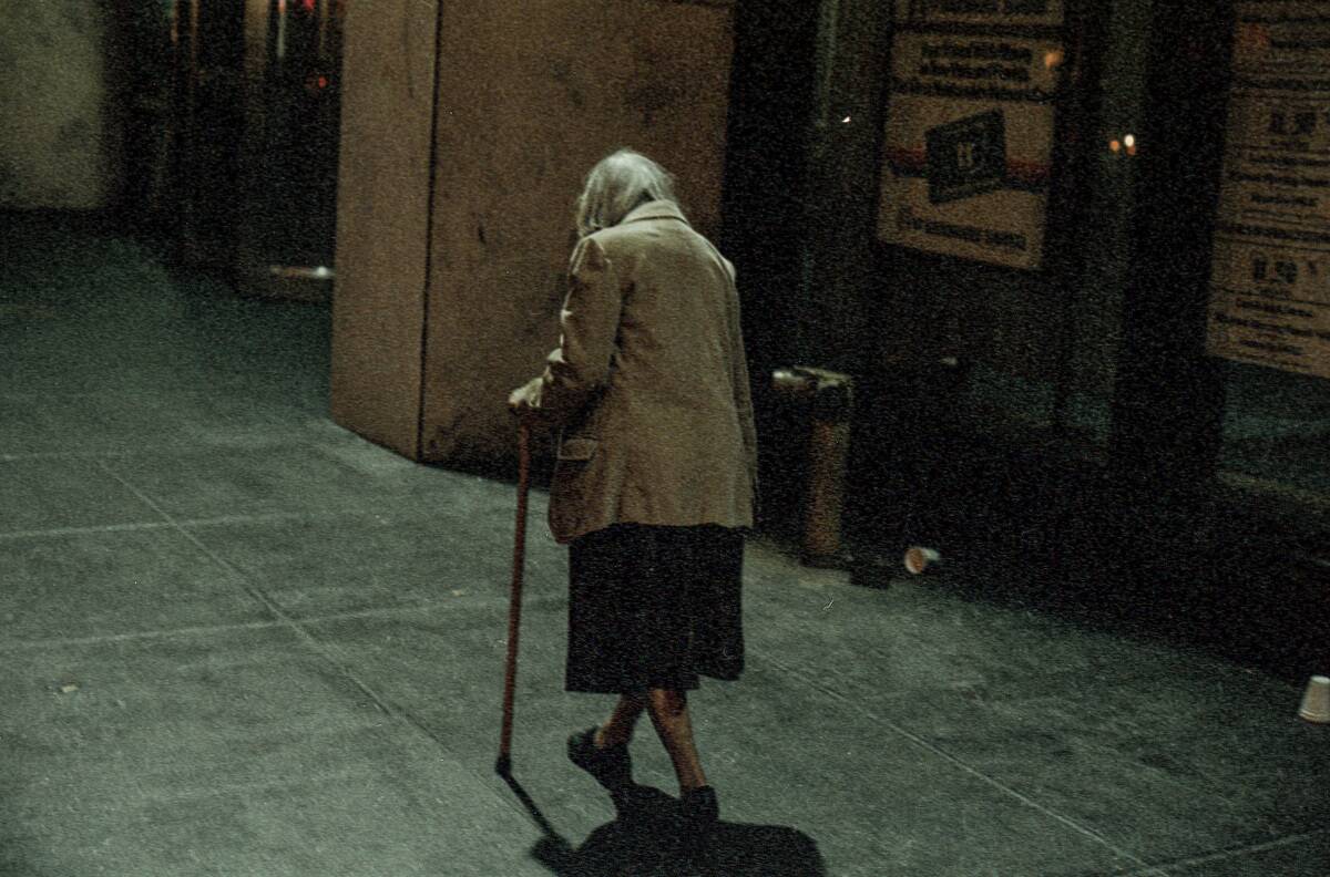 Old Woman Walking In Times Square