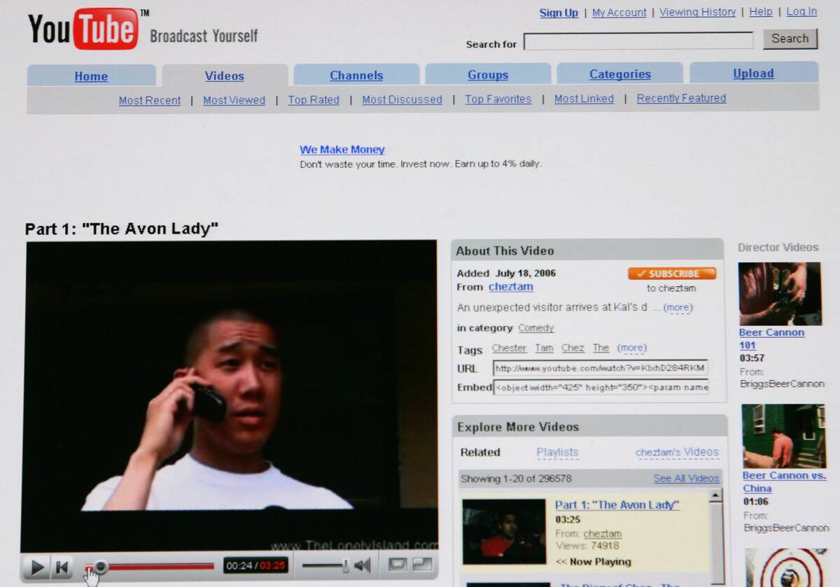 The website for YouTube is displayed on a computer monitor i