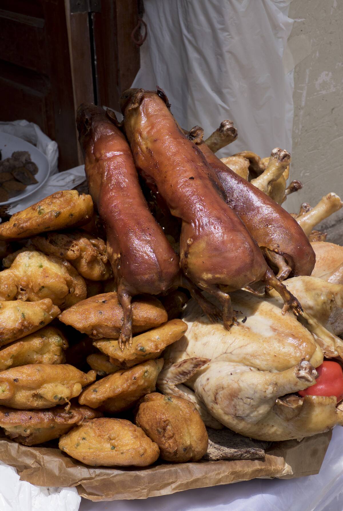 Traditional cuy roasted pig and chicharron food at the San Jacinto fiesta.